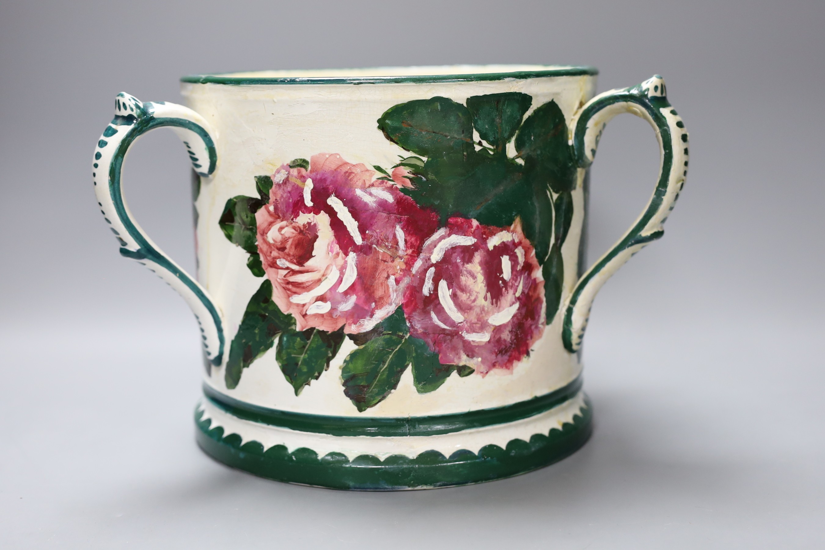 A large Wemyss three handled green and white tankard vase with floral decoration (restored), 19cm tall